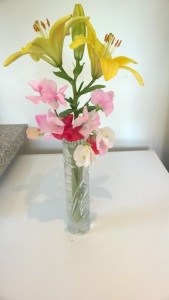 Lilies and sweet peas in vase